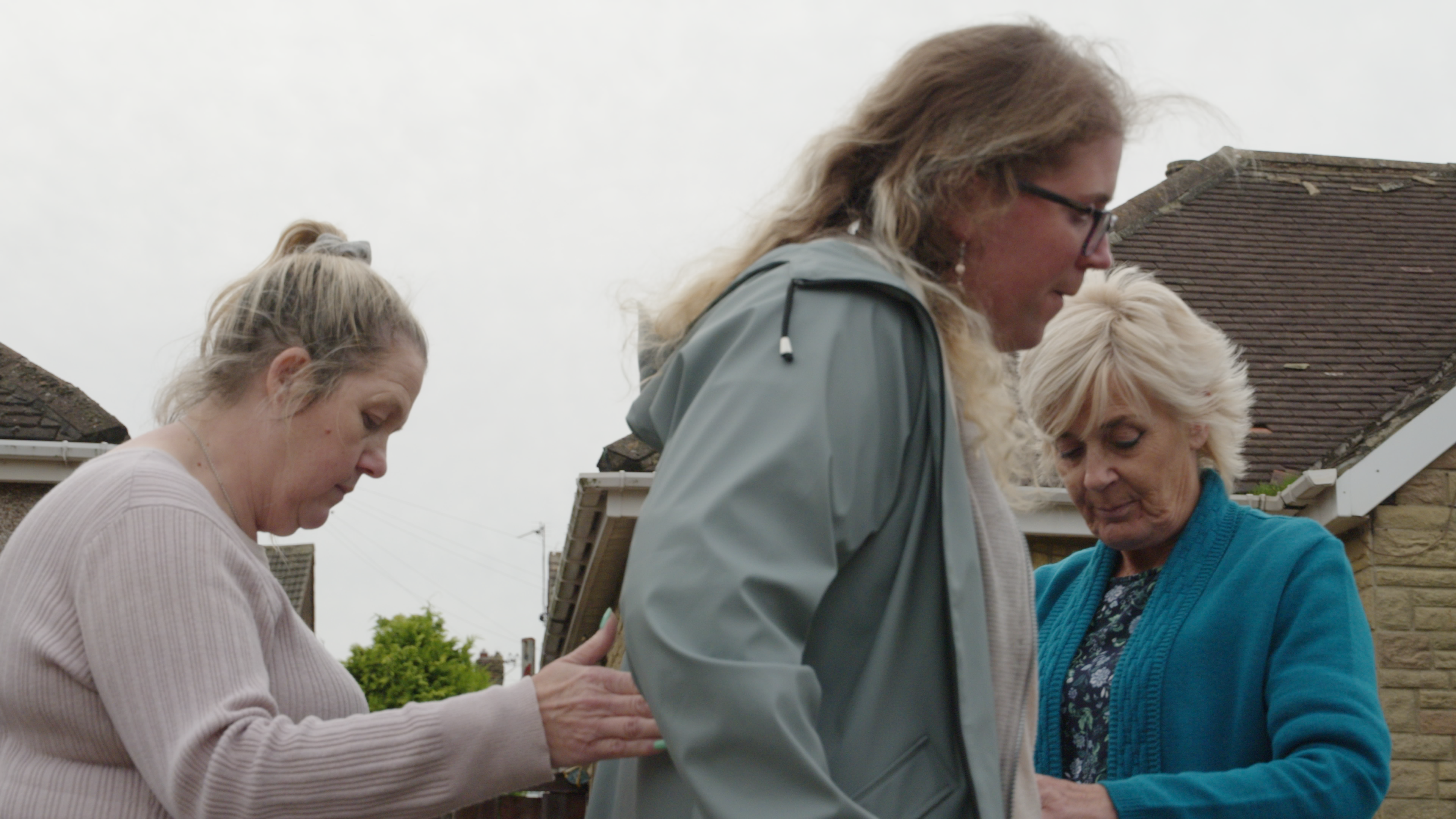 A photo of a young lady being supported.