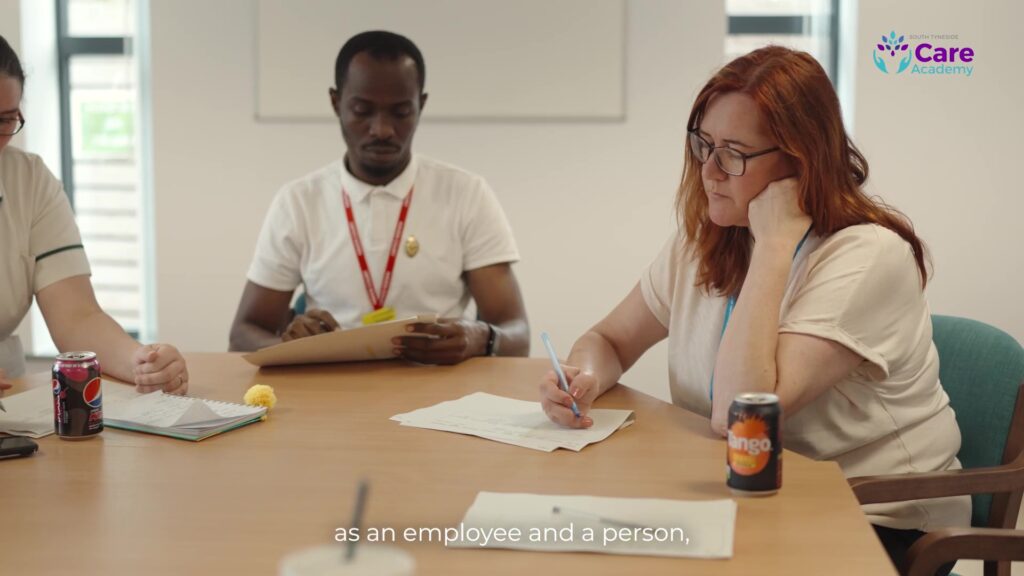 A photo of a social worker in a meeting.